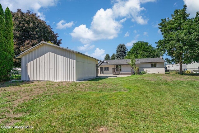 320 E Dakota Ave, Hayden, ID 83835 - back of property featuring a lawn and a patio area