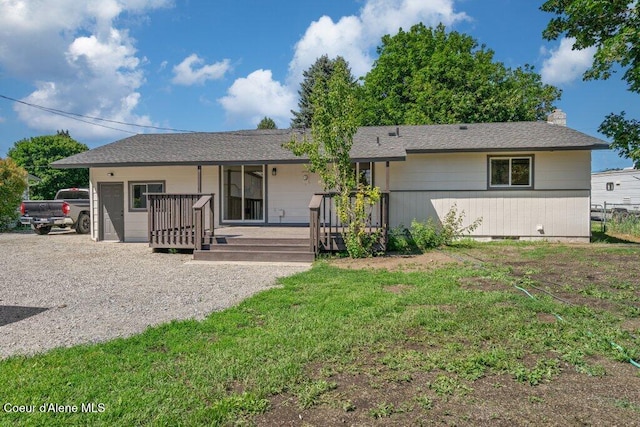 320 E Dakota Ave, Hayden, ID 83835 - view of front of home with covered porch, a chimney, and a front yard