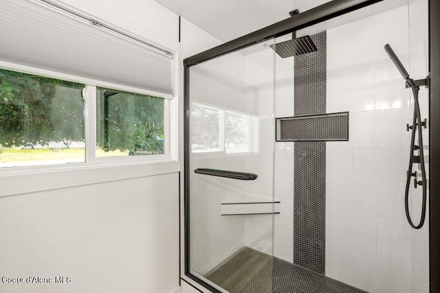 320 E Dakota Ave, Hayden, ID 83835 - bathroom with a stall shower and healthy amount of natural light