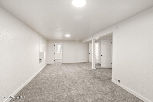 320 E Dakota Ave, Hayden, ID 83835 - below grade area featuring carpet flooring and a textured wall