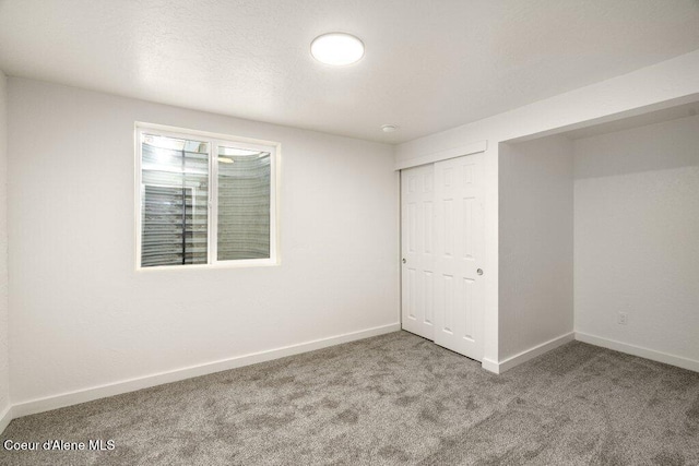 320 E Dakota Ave, Hayden, ID 83835 - unfurnished bedroom featuring carpet flooring and a closet