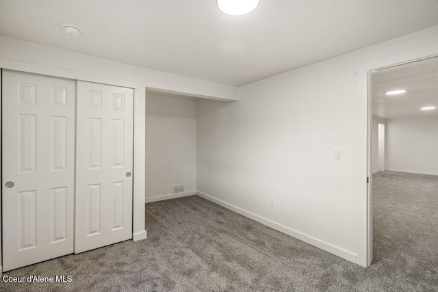 320 E Dakota Ave, Hayden, ID 83835 - unfurnished bedroom featuring carpet and a closet