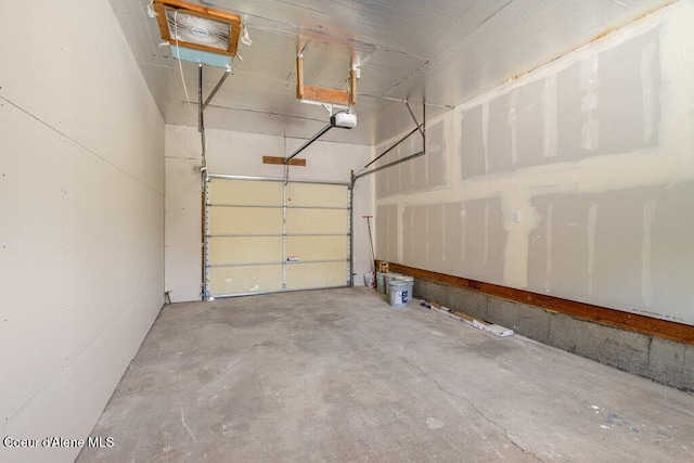 320 E Dakota Ave, Hayden, ID 83835 - garage featuring a garage door opener