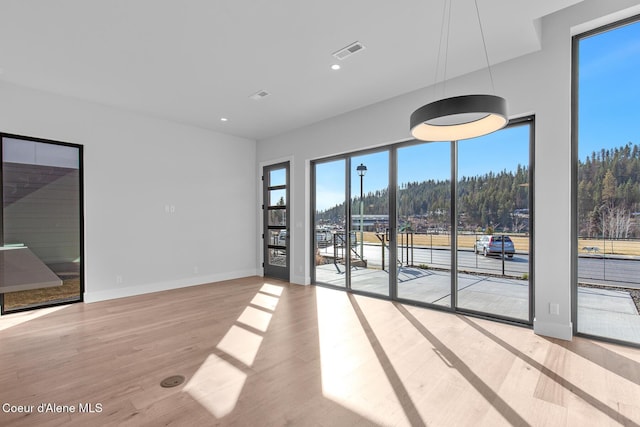 2492 N Atlas Rd, Coeur Dalene, ID 83814 - spare room with wood finished floors and recessed lighting