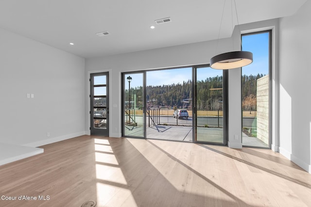 2492 N Atlas Rd, Coeur Dalene, ID 83814 - empty room featuring wood finished floors and recessed lighting