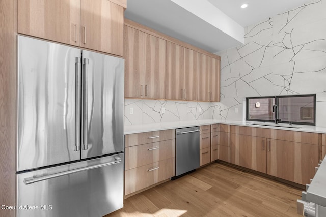 2492 N Atlas Rd, Coeur Dalene, ID 83814 - kitchen featuring appliances with stainless steel finishes, light brown cabinets, light countertops, decorative backsplash, and recessed lighting