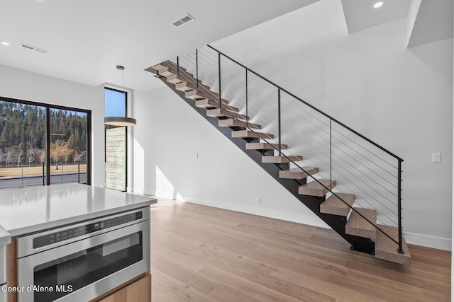 2492 N Atlas Rd, Coeur Dalene, ID 83814 - stairway with wood finished floors and recessed lighting