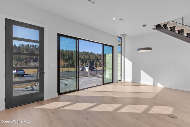 2492 N Atlas Rd, Coeur Dalene, ID 83814 - spare room featuring wood finished floors, recessed lighting, and stairs