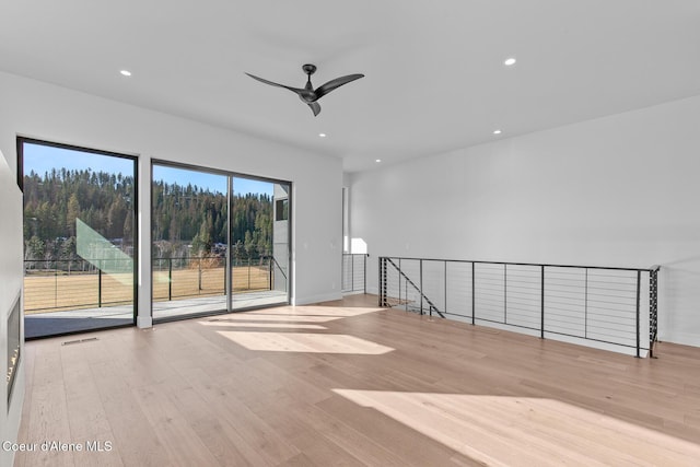 2492 N Atlas Rd, Coeur Dalene, ID 83814 - spare room with wood finished floors, a ceiling fan, and recessed lighting