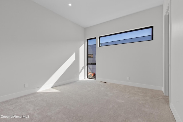2492 N Atlas Rd, Coeur Dalene, ID 83814 - unfurnished bedroom with carpet, vaulted ceiling, and recessed lighting
