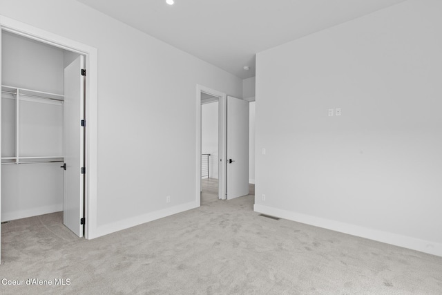 2492 N Atlas Rd, Coeur Dalene, ID 83814 - unfurnished bedroom featuring carpet floors, a spacious closet, a closet, and recessed lighting
