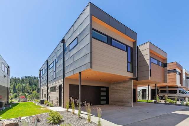 2492 N Atlas Rd, Coeur Dalene, ID 83814 - view of building exterior featuring a garage, driveway, and a carport