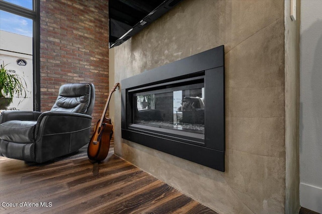 9137 N Raintree Ln, Hayden, ID 83835 - detailed view of wood finished floors and a glass covered fireplace