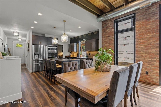 9137 N Raintree Ln, Hayden, ID 83835 - dining area featuring brick wall, wood finished floors, and recessed lighting
