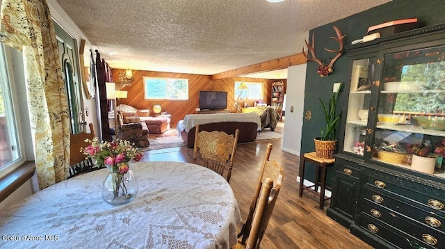 1150 Elm Dr, Saint Maries, ID 83861 - dining area with a textured ceiling, wood finished floors, and wooden walls