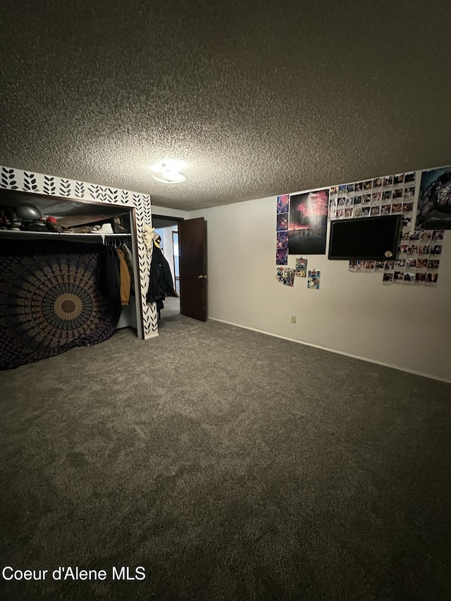 1150 Elm Dr, Saint Maries, ID 83861 - unfurnished bedroom featuring carpet floors and a textured ceiling