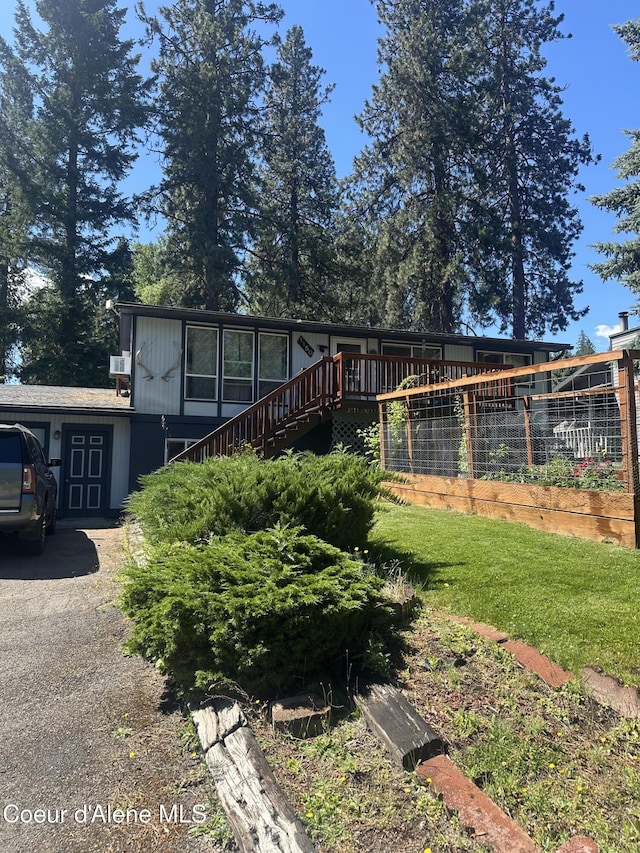 1150 Elm Dr, Saint Maries, ID 83861 - view of front facade featuring stairs and a deck