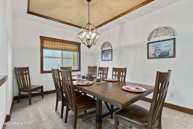 13408 E Copper River Ln, Spokane, WA 99206 - dining room featuring light colored carpet, a tray ceiling, and a chandelier