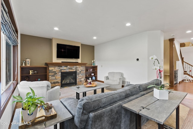 13408 E Copper River Ln, Spokane, WA 99206 - living room featuring recessed lighting, wood finished floors, stairway, and a stone fireplace
