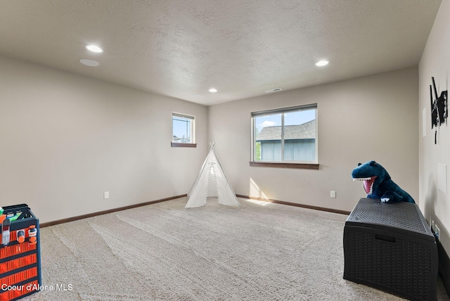 13408 E Copper River Ln, Spokane, WA 99206 - rec room featuring carpet floors, recessed lighting, and a textured ceiling