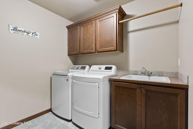13408 E Copper River Ln, Spokane, WA 99206 - washroom featuring independent washer and dryer, cabinet space, and light tile patterned floors