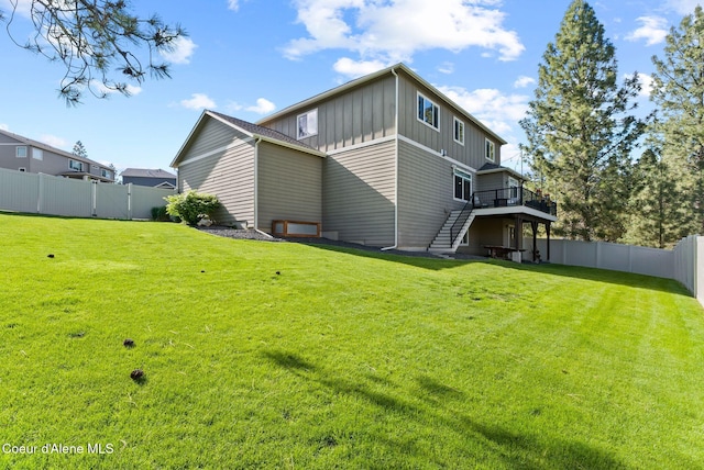 13408 E Copper River Ln, Spokane, WA 99206 - rear view of property with board and batten siding, stairs, a wooden deck, and a fenced backyard