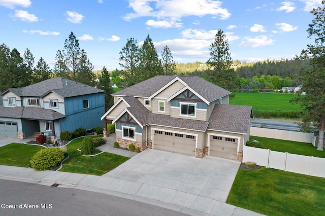 13408 E Copper River Ln, Spokane, WA 99206 - craftsman-style house with stone siding, driveway, an attached garage, and roof with shingles
