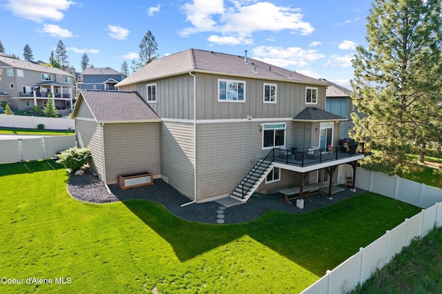 13408 E Copper River Ln, Spokane, WA 99206 - back of house with stairway, a fenced backyard, and board and batten siding