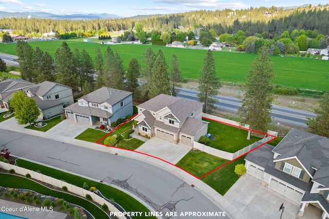 13408 E Copper River Ln, Spokane, WA 99206 - aerial perspective of suburban area with property parcel outlined and a mountainous background