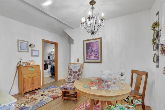 1505 N 3rd, Coeur Dalene, ID 83814 - dining space with light wood-type flooring and a chandelier