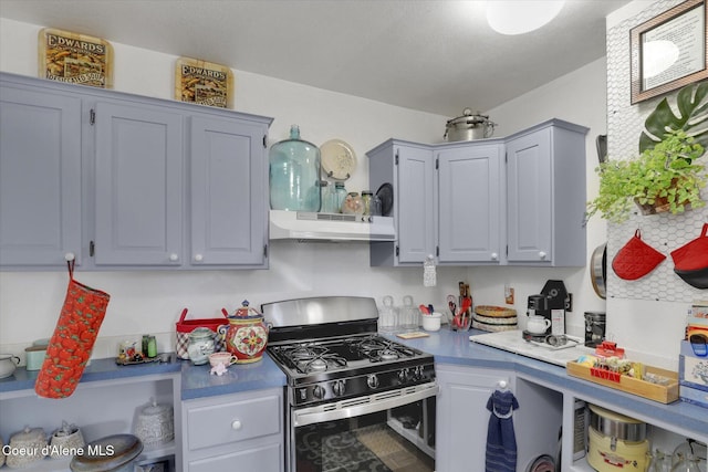 1505 N 3rd, Coeur Dalene, ID 83814 - kitchen with stainless steel gas range, under cabinet range hood, and gray cabinets