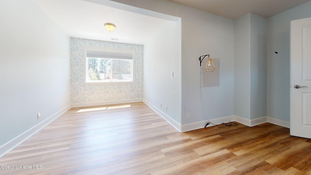 1121 E Indiana Ave, Coeur Dalene, ID 83814 - empty room featuring light wood-type flooring and wallpapered walls