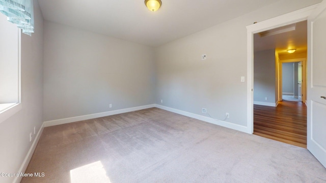 1121 E Indiana Ave, Coeur Dalene, ID 83814 - empty room with carpet floors and baseboards