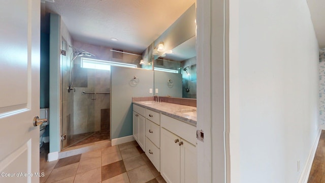 1121 E Indiana Ave, Coeur Dalene, ID 83814 - full bath featuring double vanity, tiled shower, and tile patterned floors