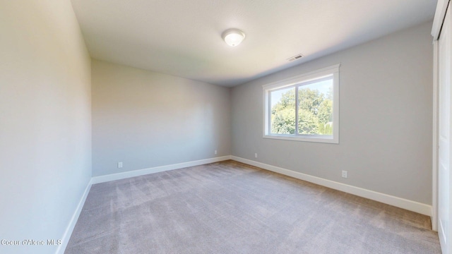1121 E Indiana Ave, Coeur Dalene, ID 83814 - carpeted empty room featuring baseboards