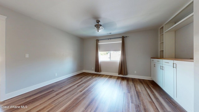 1121 E Indiana Ave, Coeur Dalene, ID 83814 - empty room with wood finished floors and ceiling fan