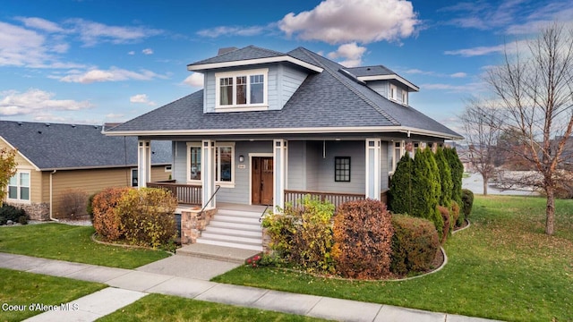 2848 N O Connor Blvd, Post Falls, ID 83854 - view of front facade featuring a front lawn, covered porch, and a shingled roof
