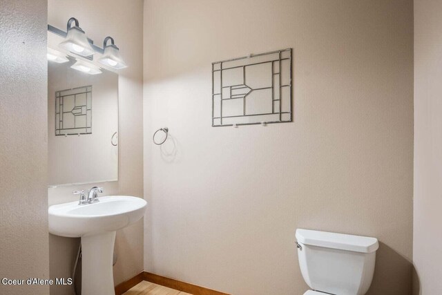 2848 N O Connor Blvd, Post Falls, ID 83854 - bathroom featuring toilet and wood finished floors