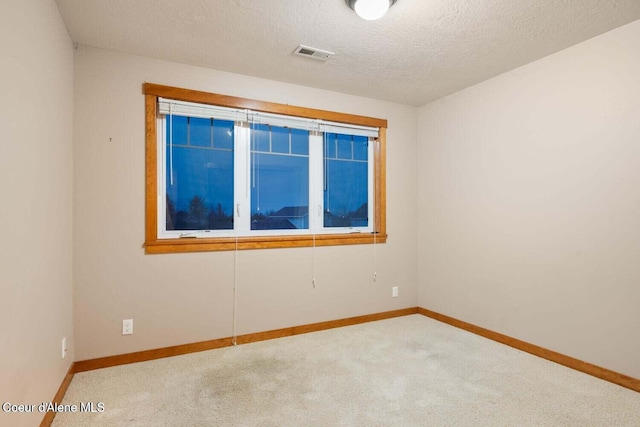 2848 N O Connor Blvd, Post Falls, ID 83854 - spare room with carpet flooring and a textured ceiling