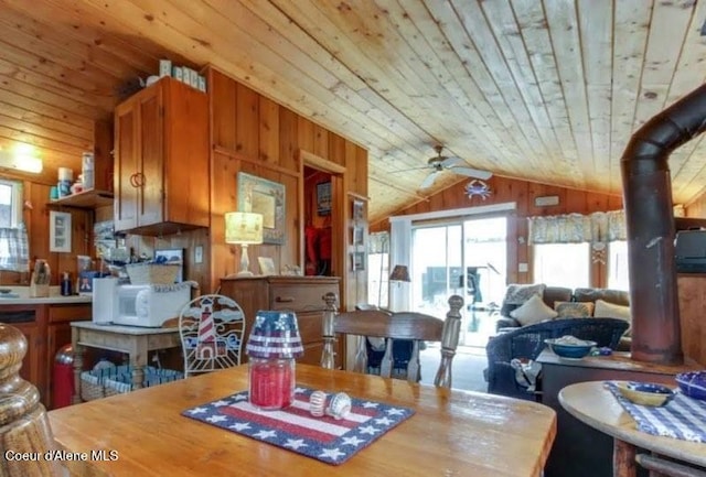 16946 E Jds E Dock 27, Bayview, ID 83803 - dining space featuring vaulted ceiling, wood ceiling, healthy amount of natural light, wood walls, and a ceiling fan