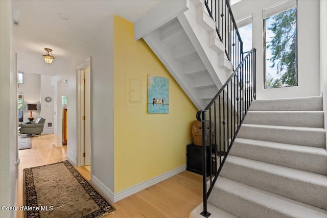 5276 W Racquet Rd Unit 9, Rathdrum, ID 83858 - stairs featuring wood finished floors and plenty of natural light