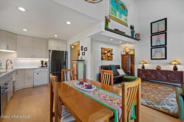 5276 W Racquet Rd Unit 9, Rathdrum, ID 83858 - dining area with light wood-style flooring and recessed lighting