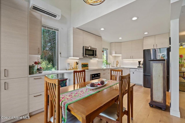 5276 W Racquet Rd Unit 9, Rathdrum, ID 83858 - dining space featuring an AC wall unit, healthy amount of natural light, and recessed lighting