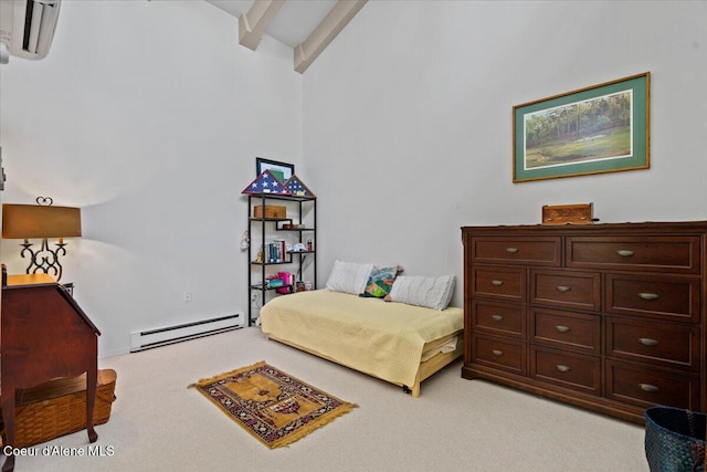 5276 W Racquet Rd Unit 9, Rathdrum, ID 83858 - bedroom with a baseboard heating unit and light carpet