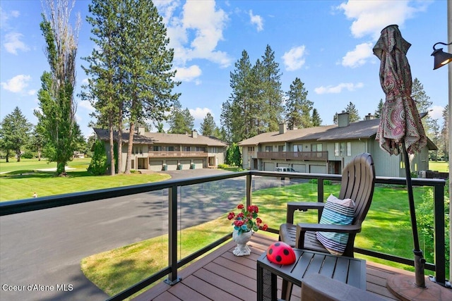 5276 W Racquet Rd Unit 9, Rathdrum, ID 83858 - wooden deck with a yard and a residential view