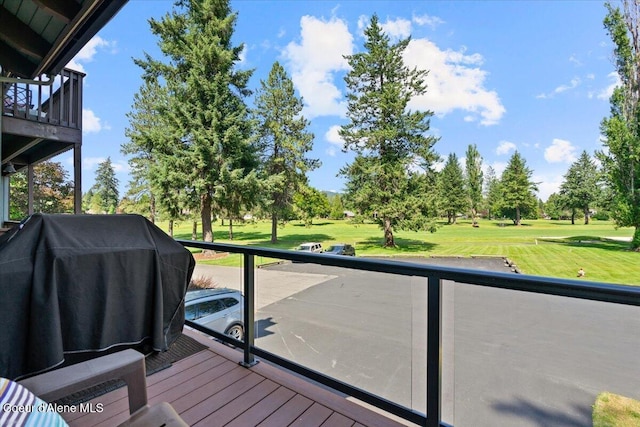 5276 W Racquet Rd Unit 9, Rathdrum, ID 83858 - wooden terrace featuring area for grilling, a lawn, and view of golf course