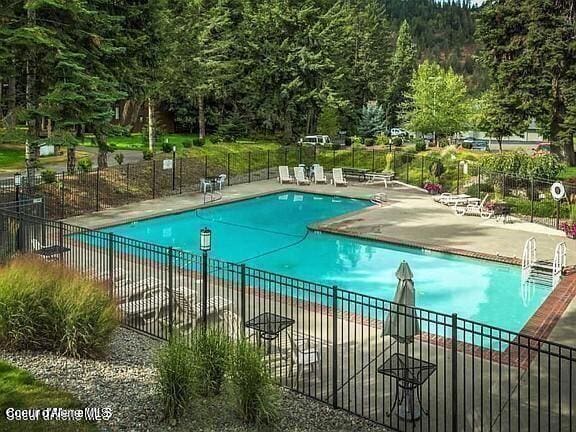 5276 W Racquet Rd Unit 9, Rathdrum, ID 83858 - community pool featuring a patio
