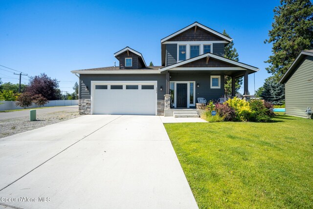 2499 N N Side Saddle Ln, Post Falls, ID 83854 - craftsman-style house with driveway, a garage, and stone siding