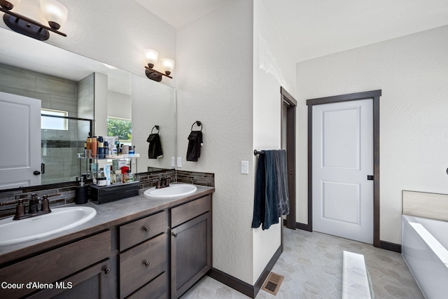 2499 N N Side Saddle Ln, Post Falls, ID 83854 - full bathroom featuring double vanity, a stall shower, and a freestanding bath