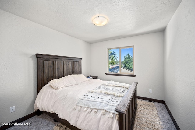 2499 N N Side Saddle Ln, Post Falls, ID 83854 - bedroom with carpet floors, a textured ceiling, and a textured wall